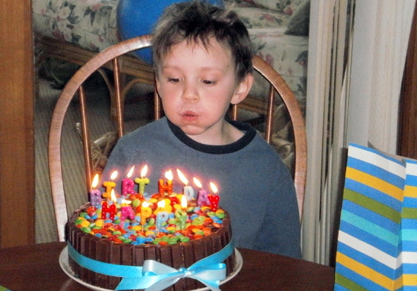 Elliot Blowing Out His Candles