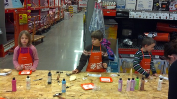 Mari, Andrew, and Elliot, sporting their Home Depot aprons